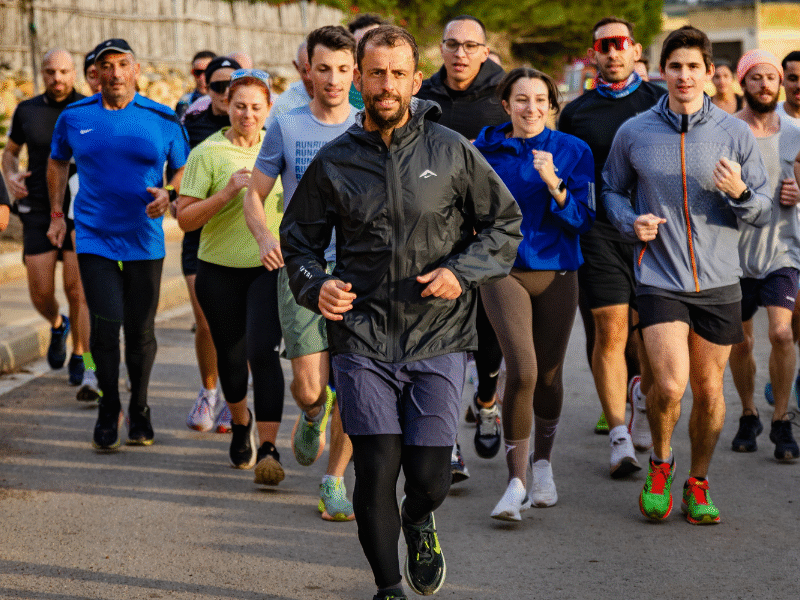 Zach Vella running with a group during a training session for his London to Malta fundraising challenge supporting homelessness in Malta.