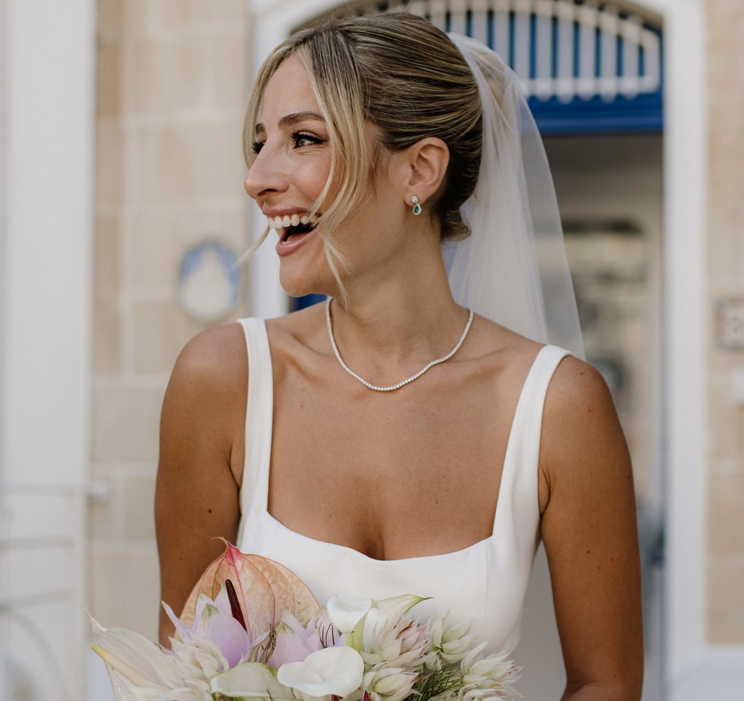 Bride with soft bridal hairstyle and natural makeup by Dean Gera Salons
